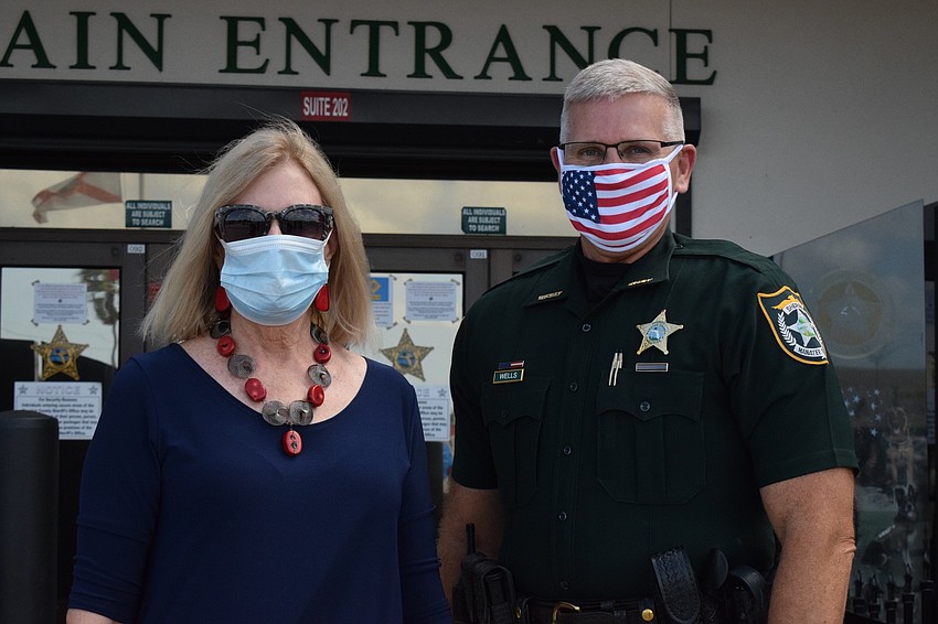 River Club's Carole Sullivan delivers gift bags to Sheriff Rick Wells with the Manatee County Sheriff's Office to show appreciation for law enforcement. Sullivan worked with 13 other Lakewood Ranch residents to make the bags.