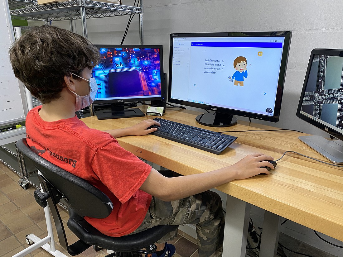 A student at the  Suncoast Science Center Faulhaber Fab Lab uses the COVIDucation site.
