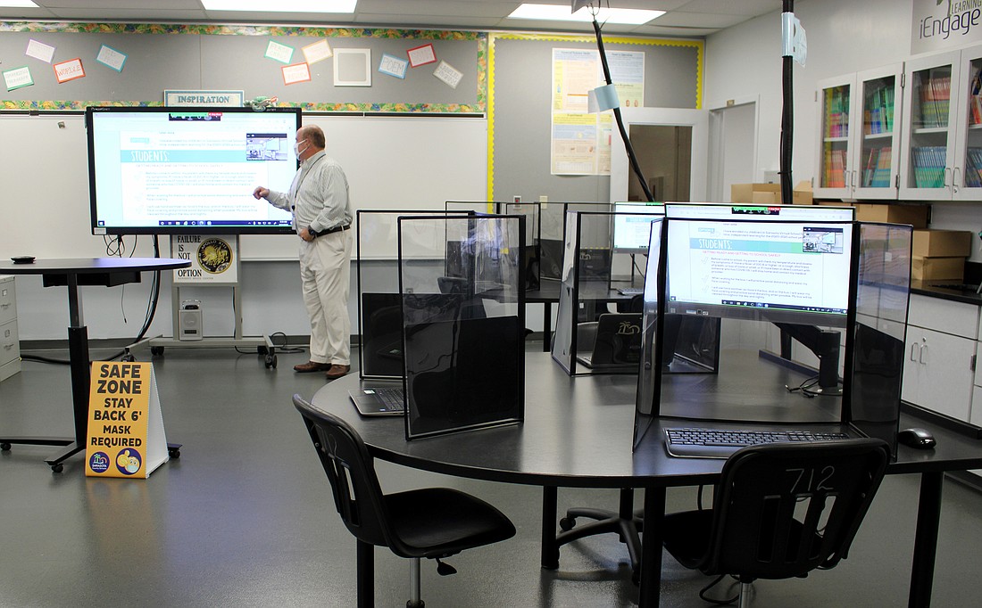 Each classroom is fitted with plastic barriers to help keep particles from spreading.  Photo courtesy of Sarasota County Schools