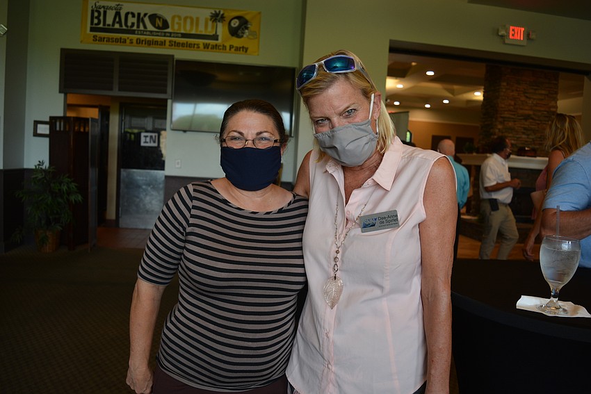 Debbie Shaffer, of Cool Today, Plumbing Today and Energy Today, networks with Suncoast News Network's Diane de Spirlet.