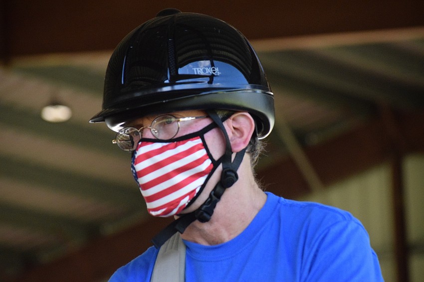 Dan Mohl enjoys his first lesson at the Sarasota-Manatee Association for Riding Therapy he's had since the pandemic began. Mohl hasn't been able to leave his assisted living facility to ride in at least five months.
