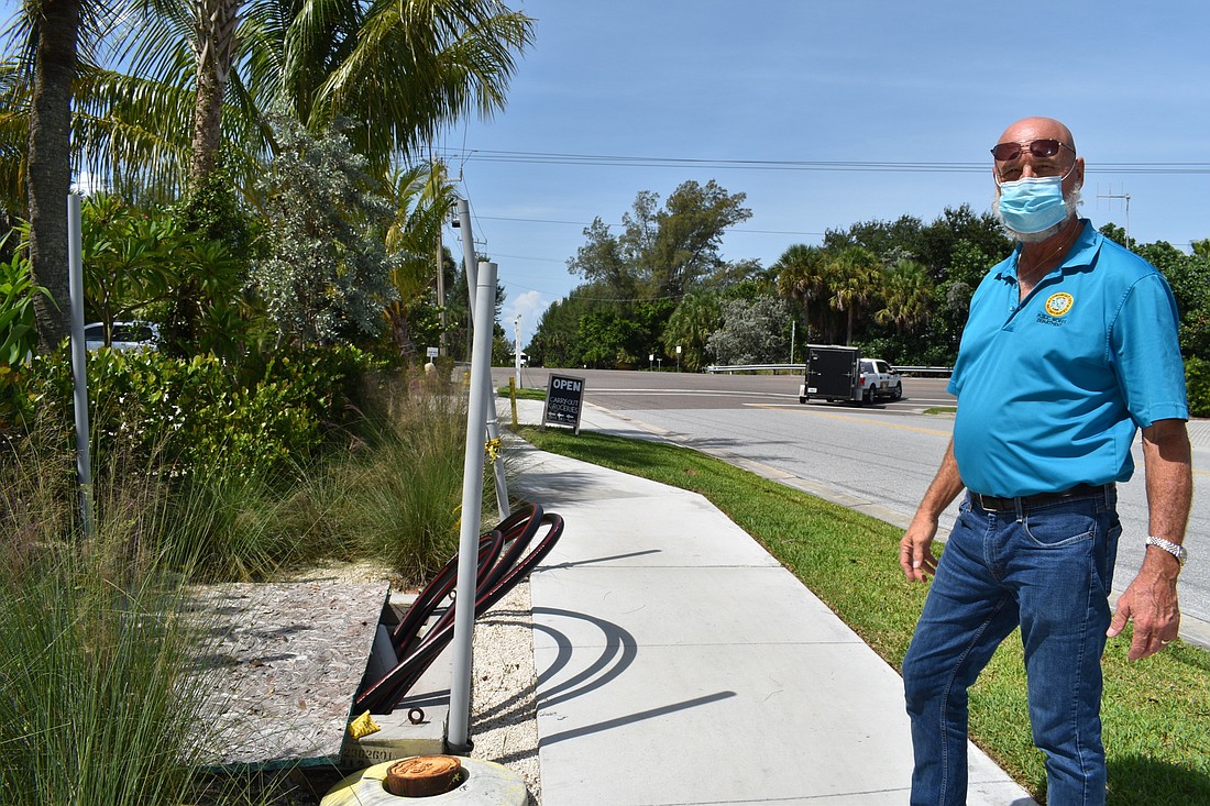 Longboat Key projects manager James Linkogle shows how the town&#39;s undergrounding utility service will replace FPL poles.