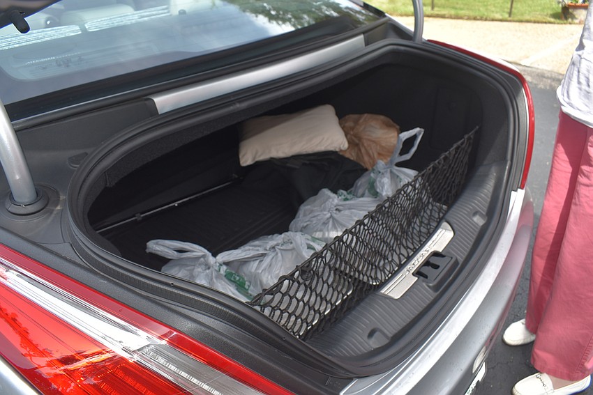Most pick-up customers pop open the trunk for meal delivery.