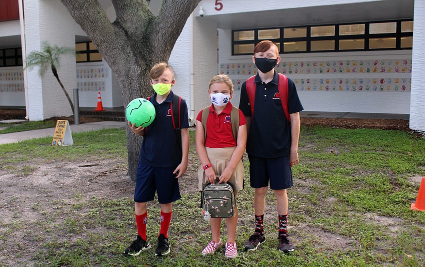 Cooper Hamilton, Caroline Piazza and Kennedy Hamilton are excited to start their first day at Southside Elementary School. Brynn Mechem