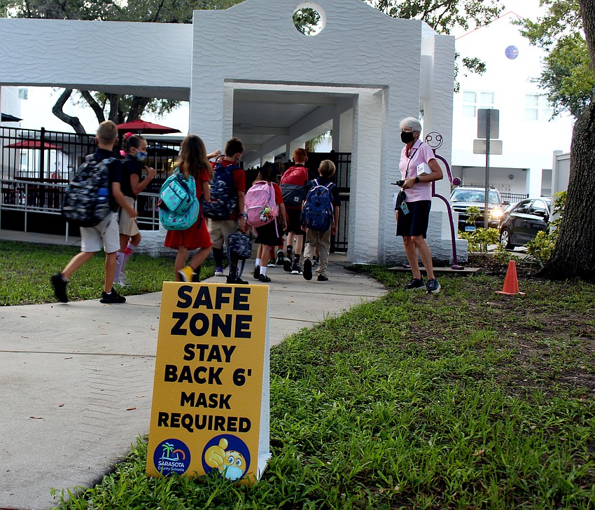 Students say goodbye to their parents and walk into Southside Elementary School alone. Brynn Mechem