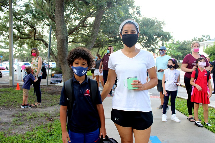 Gabriel Ortega and Olfa Reyez-Ortega walk to Southside Elementary School. Brynn Mechem