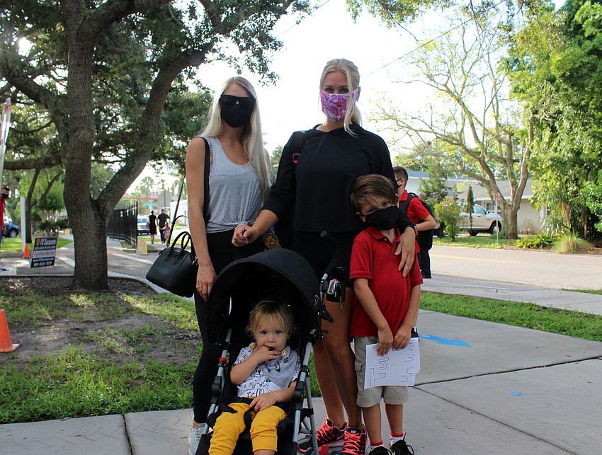 Alex Boyajian takes a picture with his family before walking into Southside Elementary School. Brynn Mechem
