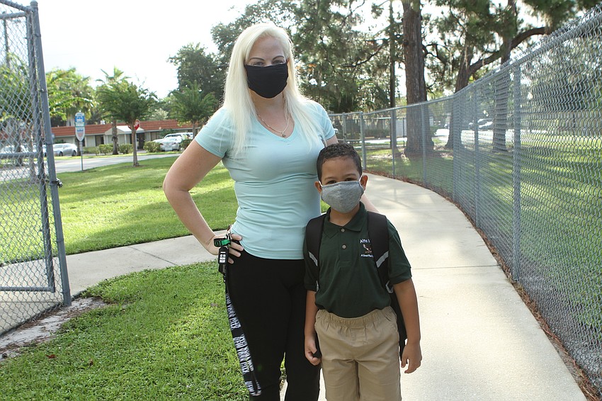 Rachel and Joshua LaVoy walk to Alta Vista Elementary School. Harry Sayer