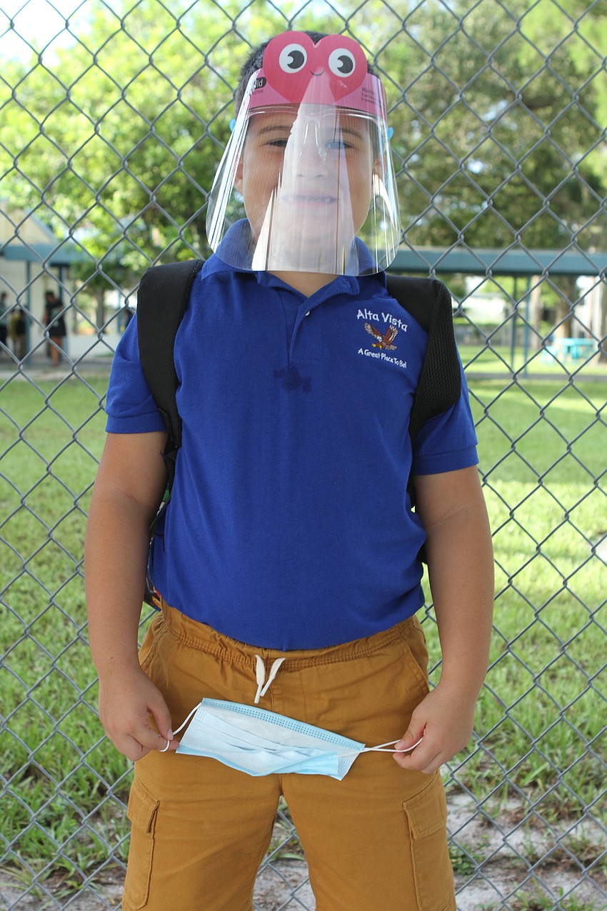 Daniel Zinetchko, 6, wears a face plate to Alta Vista Elementary School. Harry Sayer