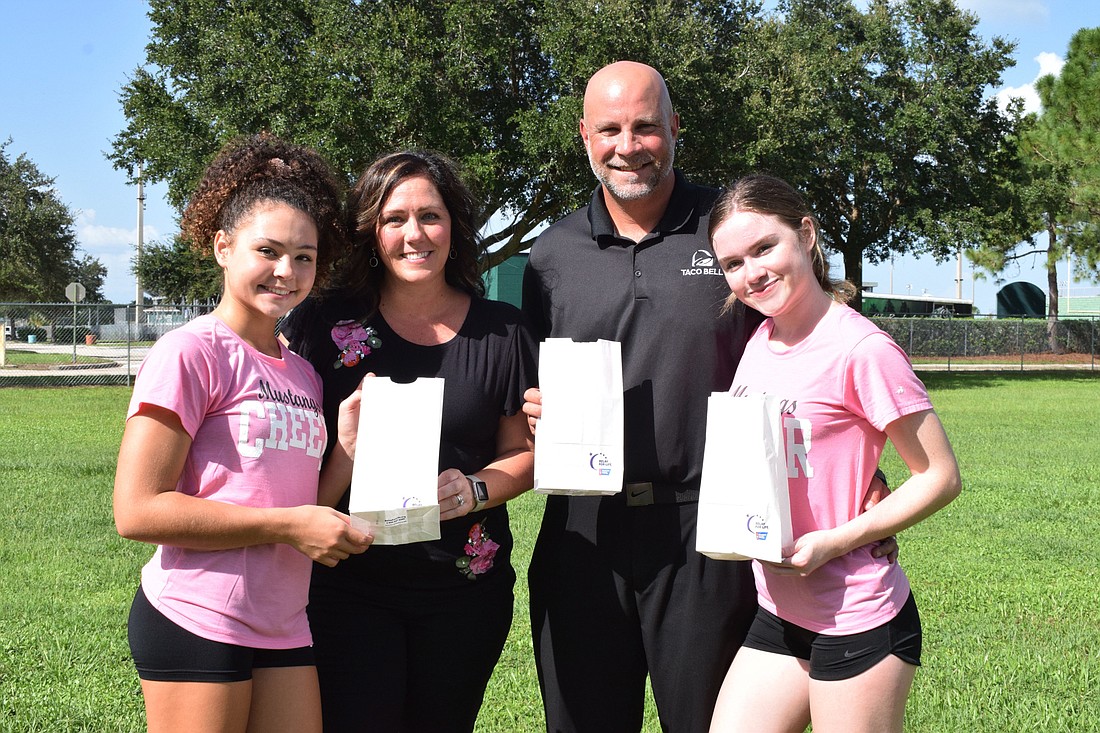 Lilly and Bethany Lynch and Larry and Tierney Thornhill look forward to Neighbors Unite in which luminaries will light up in Lakewood Ranch to honor those impacted by cancer.