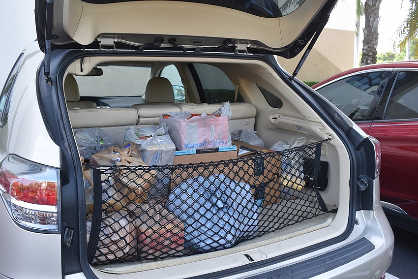 At least three cars were packed up with food.