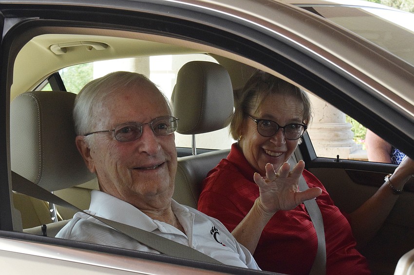 The Lake Club's Penny and Joe Lammert are the first to come through the drive thru fundraiser.