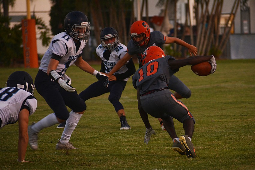 Sarasota junior TJ McKay jukes on a kickoff return.