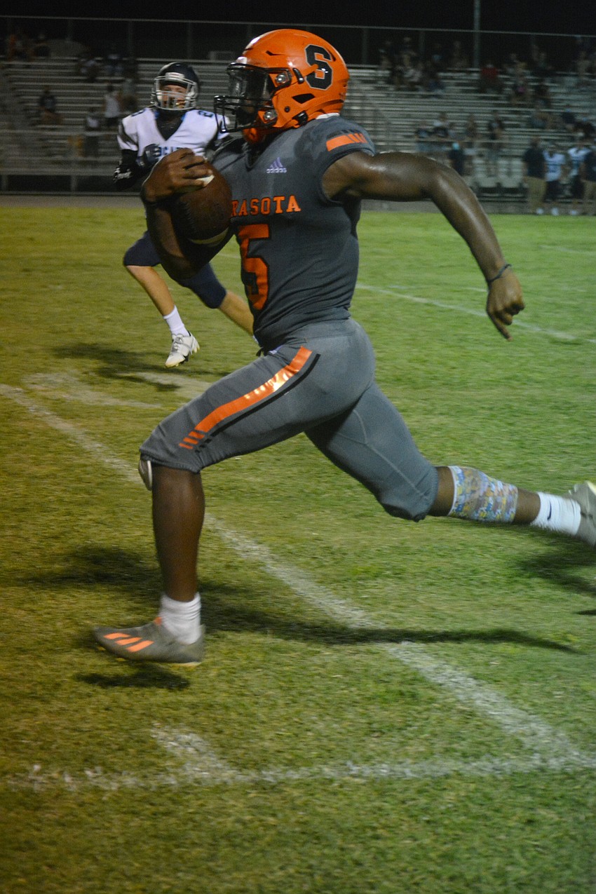 Sailors running back Jamel Holloway races down the sideline.