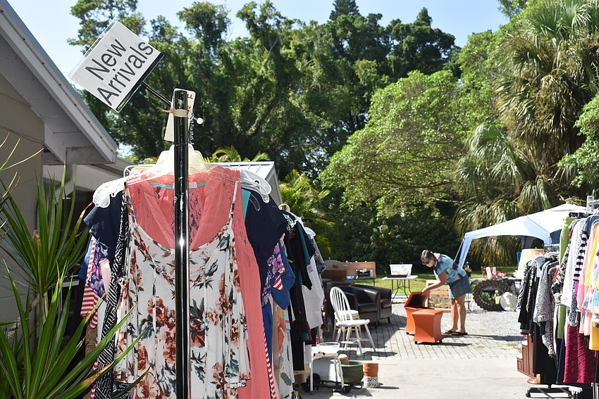 Racks were pulled outdoors to make space and allow more people to shop at one time.