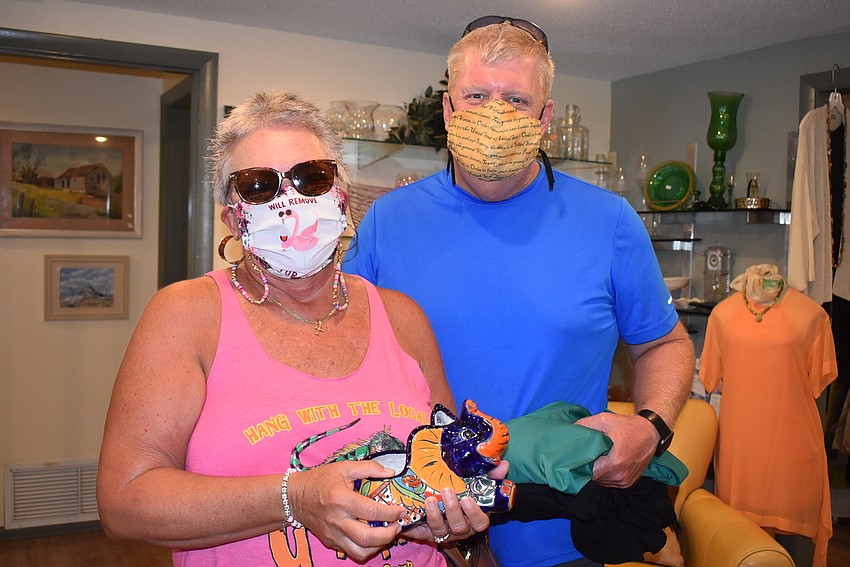 Therese and Clint Arrington with a ceramic elephant they found.