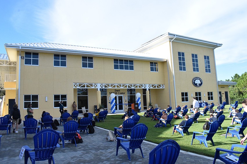 Eighth grade students wait to enter the new middle school building at The Out-of-Door Academy on their first day back on campus.