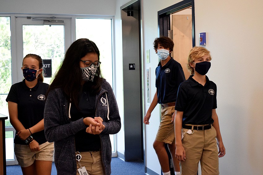 Eighth graders Katherine Triola, Izabella DeToma, Josey Rubinstein and Gabriel Owen get a first look at the new middle school facility before starting classes for the first time on campus this school year.