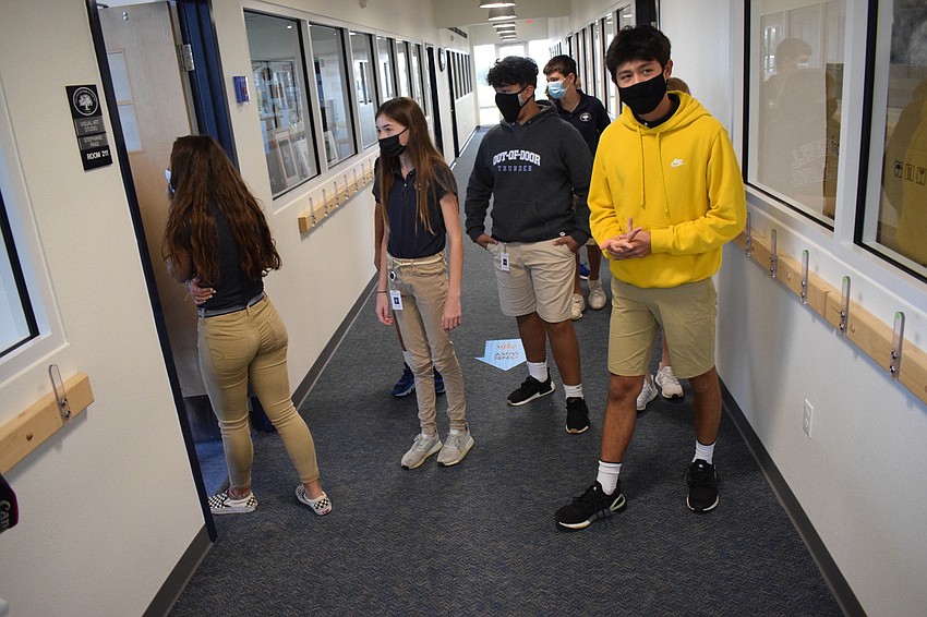 Eighth graders Lila Tack, Chloe Cochran, Marvin Palominos and Andrew Schaffer enter the visual arts classroom on the second floor.