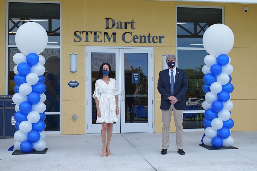Ashley Kozel, chair of The Out-of-Door Academy's Board of Trustees, and David Mahler, the head of school, celebrate the official opening of the new middle school facility. The school has been working on the school for three years.