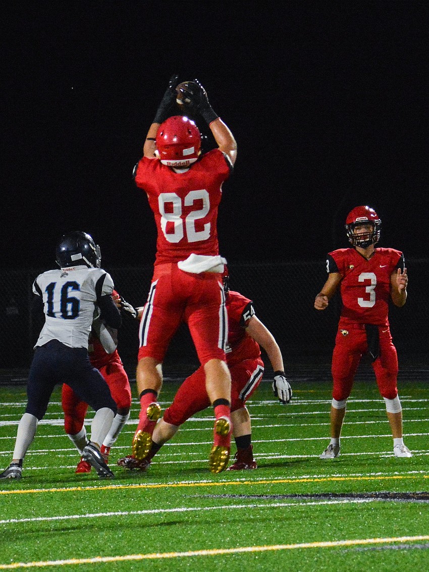 Cameron Heald leaps to make a catch on a Tayven Clark pass.