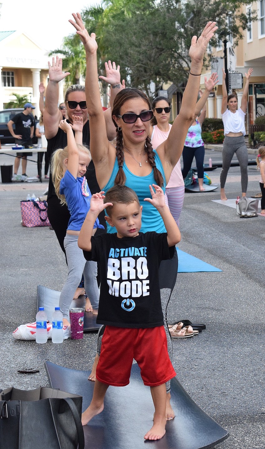 Del Tierra's Ashton Coelho, who is 3 years old, mimics the movements his mother, Cristina Coelho, makes.
