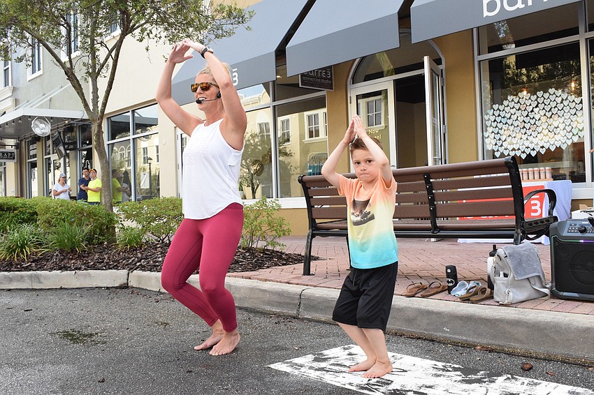 Barre3 instructor Jenna Phillips has help leading the group from her 6-year-old son Jackson Phillips. Jackson Phillips' favorite position was the Superman pose.