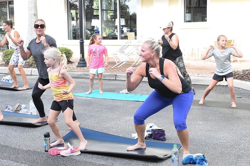Lakewood Ranch's Douggin Keiton, who is 7, starts her mother-daughter day with her mother, Kelly Keiton, at the tie-dye party.