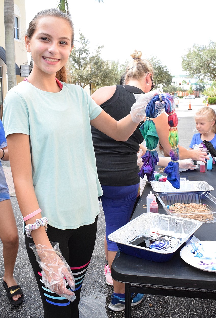 Lakewood Ranch's Madelyn Boyd shows off her tie-dye shirt. She chose to put rubber bands on the shirt for it to look like an accordion and then used random colors to dye it.