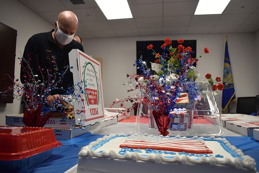Ivan Zunz selects pizza from one of the myriad boxes.