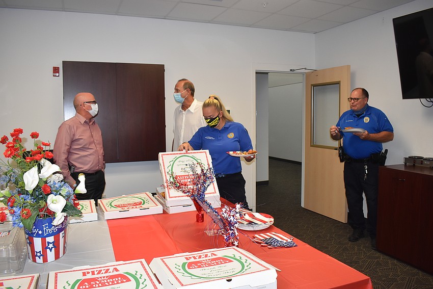 Bob Bourque, Heather Underhill and Ray Bergeron dig into lunch.