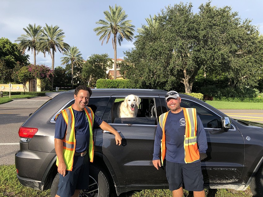 Joe Brunory, Hunter (deputy fire chief Sandi Drake's dog) and Tony Porter along the flag-planting route. Courtesy photo.