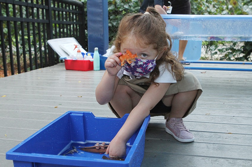 Emma Magnes showed off her dinosaur.