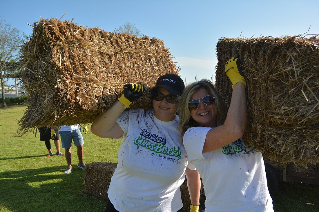 Annemarie Graff of Bank OZK and former LWRBA CEO Heather Kasten volunteer at the first annual Alliance Gives Back Volunteer Days in 2018.