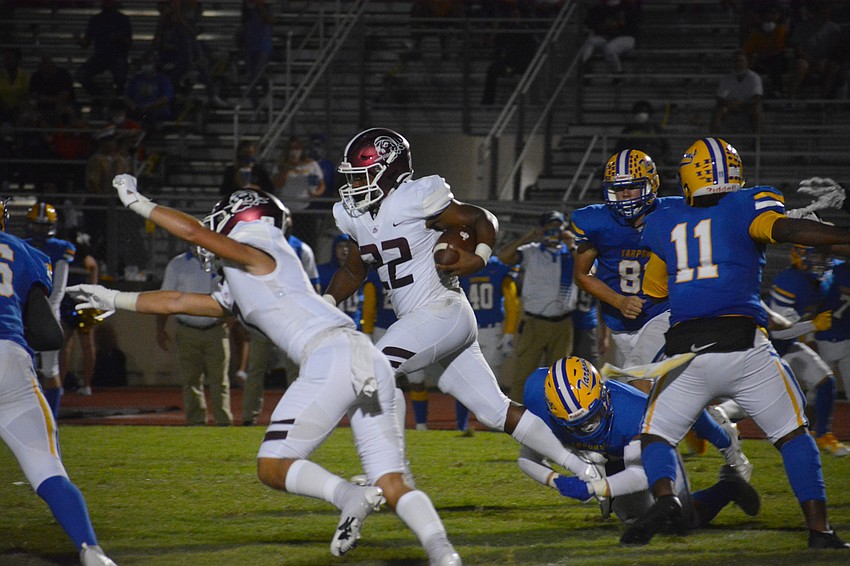 Lavontae Youmans bursts through the Tarpon defense. He finished with 91 yards on 12 carries.