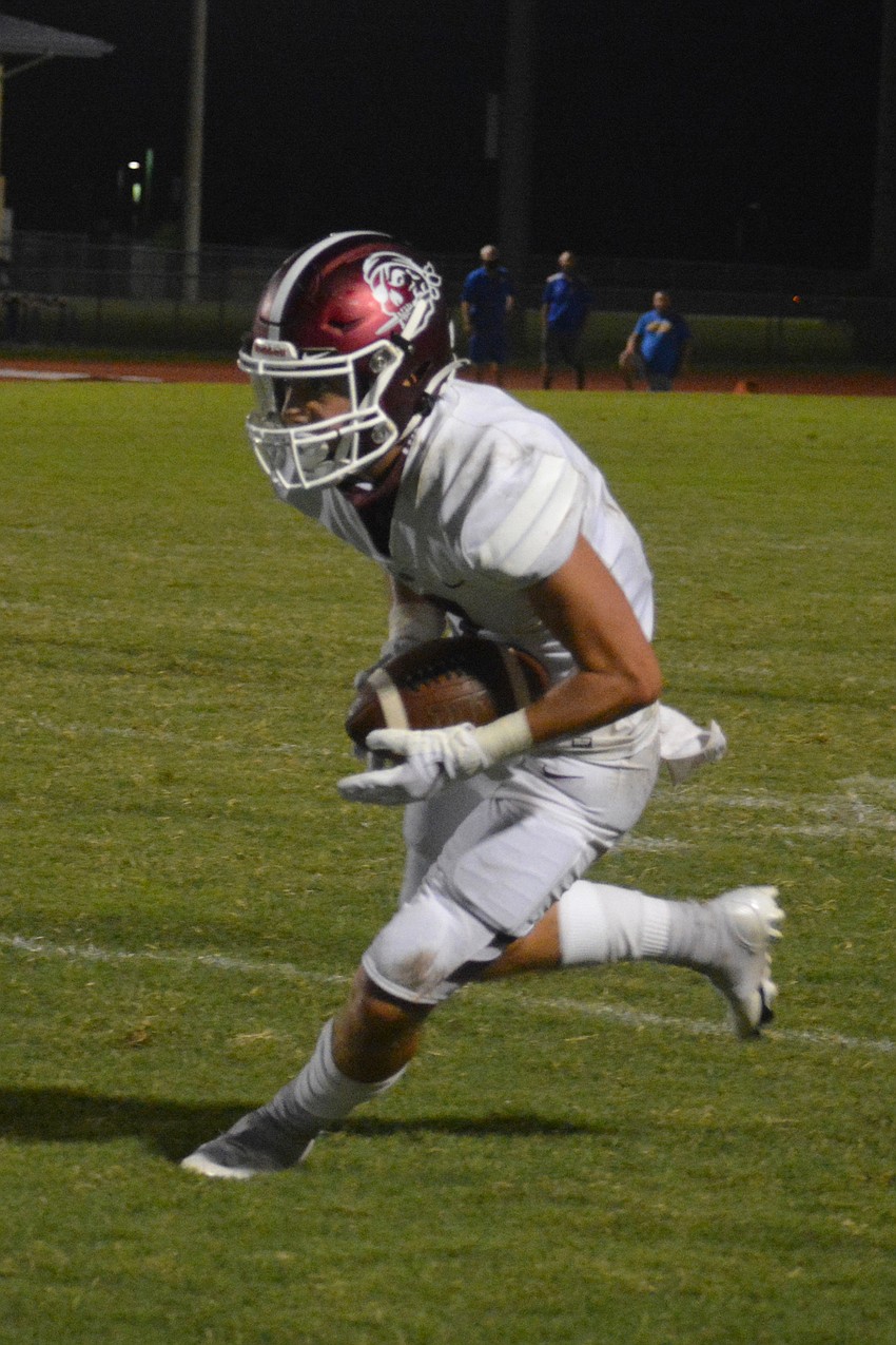 Pirates wideout Connor Losada snags a pass from Shawqi Itraish and turns upfield.