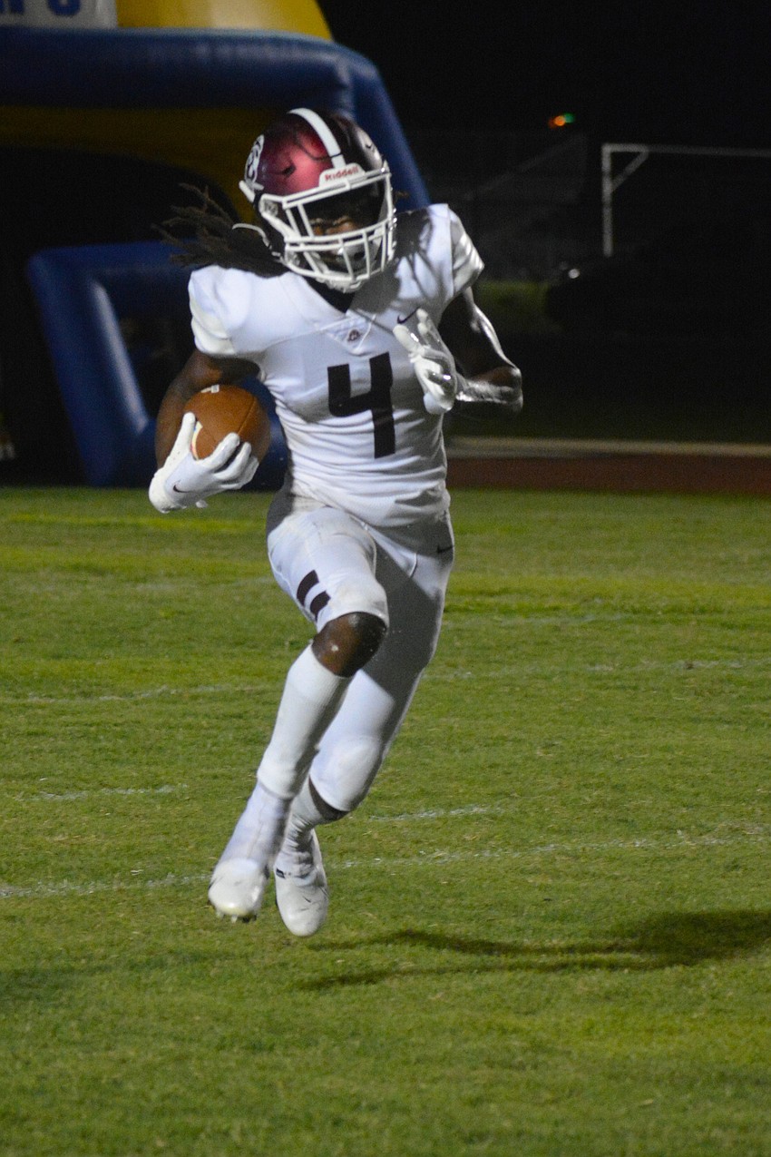 Pirates defensive back Gregory Cotton returns a Charlotte kickoff.
