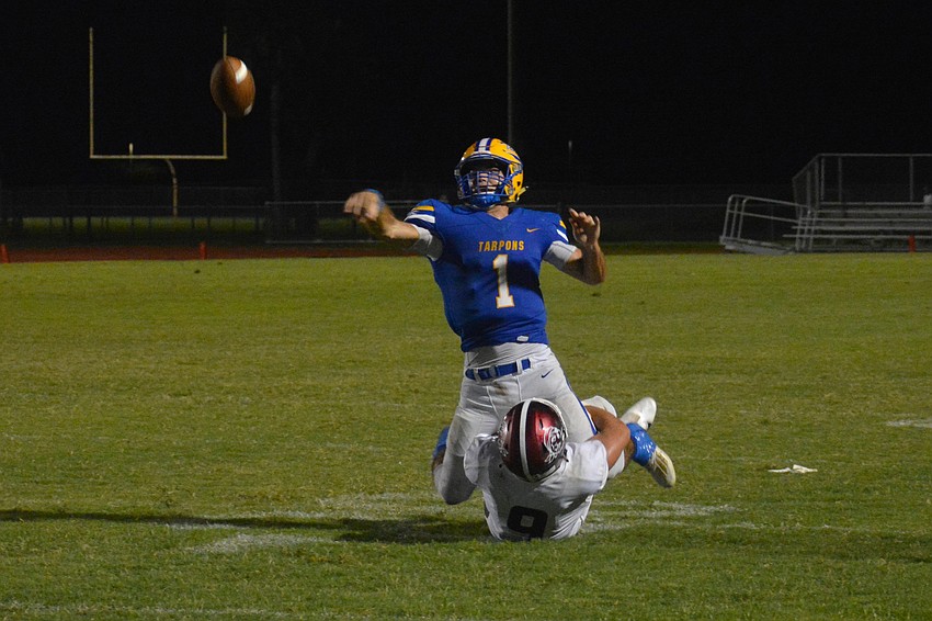 Pirates linebacker Shane Moran gets ahold of Charlotte quarterback Josh Busha as he is throwing, forcing an incompletion.