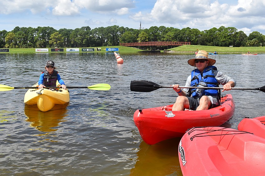 Doug Dierdorf (right) and Max Dierdorf of central Bradenton come to shore after a day on the water. They tried their hands at paddleboarding and kayaking.