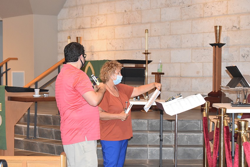 Michael Bodnyk helps Sandi Love find her place in the music.