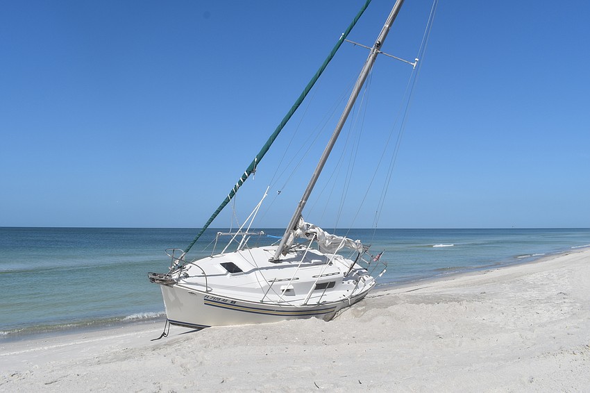 Mark Sternal's sailboat washed ashore near 4239 Gulf of Mexico Drive.