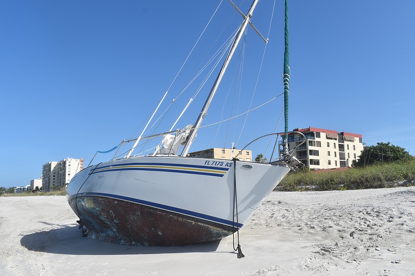 Mark Sternal's sailboat washed ashore near 4239 Gulf of Mexico Drive.