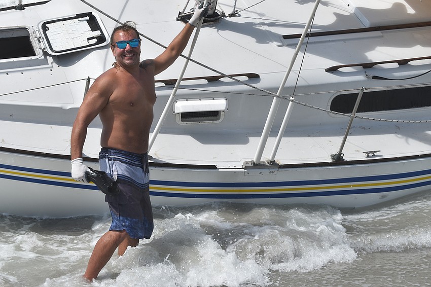 Mark Sternal's sailboat washed ashore near 4239 Gulf of Mexico Drive.