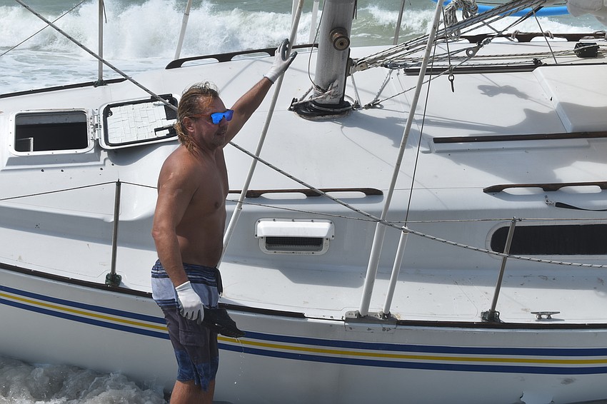 Mark Sternal's sailboat washed ashore near 4239 Gulf of Mexico Drive.