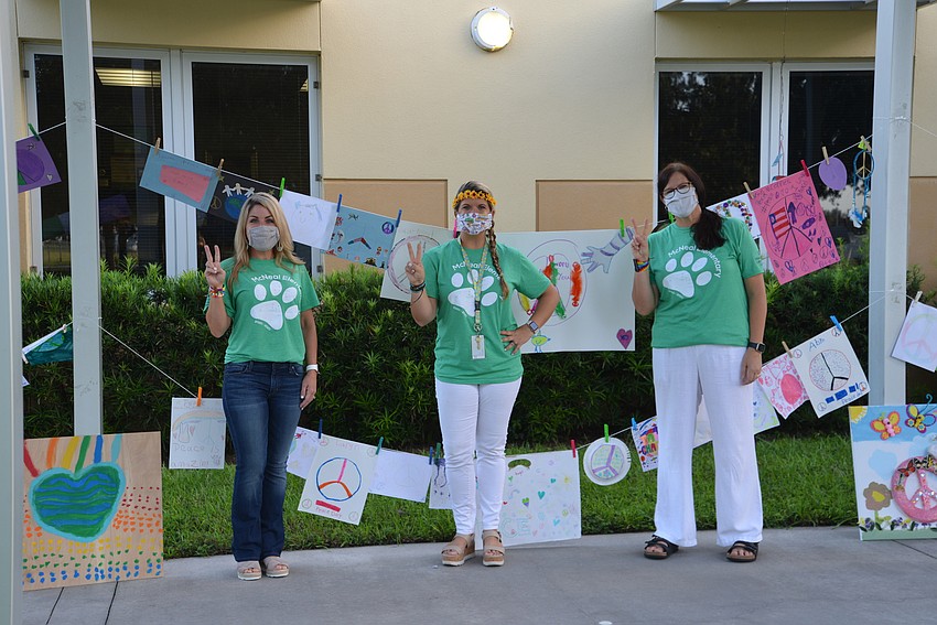 Kristi Dyer, Ashlie Fulmer and Gwyn Ingham, teachers at Gilbert W. McNeal Elementary School, love seeing the projects students create for Peace Day. Courtesy photo.