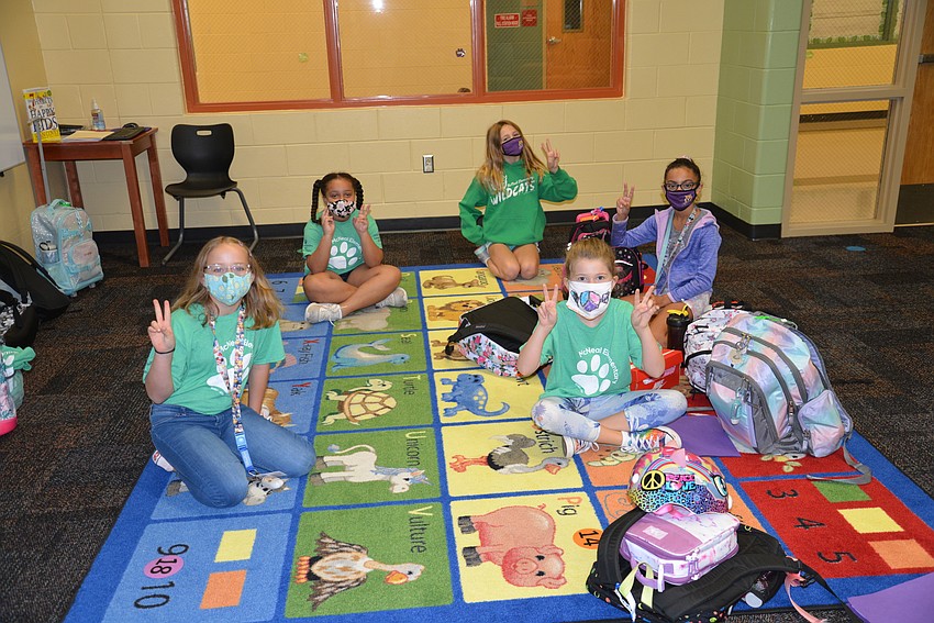 Malea Benson, Sinayah Jenkins, Brooke Hardiso, Kya Fernandez and Maxima Hodge celebrate Gilbert W. McNeal Elementary School's fifth annual Peace Day. Courtesy photo.