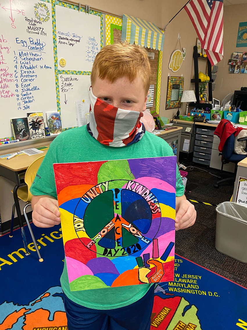 Anthony Sosso shows off his artwork for Peace Day. Courtesy photo.