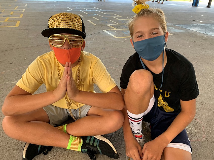 Liam Walker and Josh Folvig wear gold in support of the fundraiser. Photo courtesy