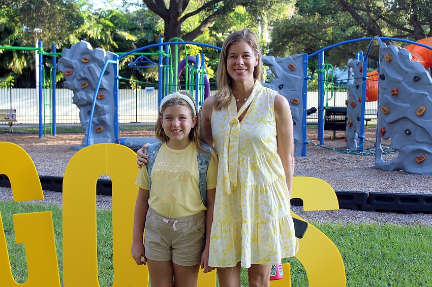 Jillian and Hilary Yunis deck out in gold in support of the fundraiser. Brynn Mechem