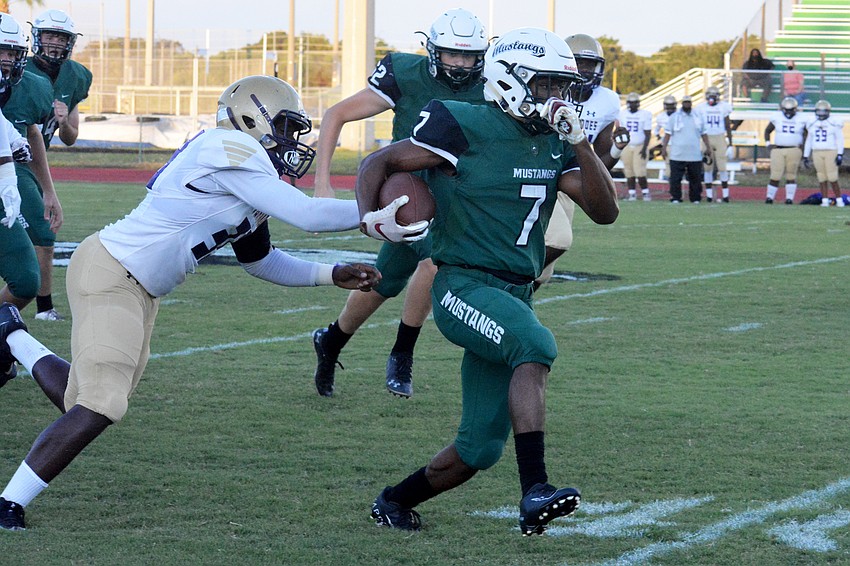 Mustangs senior running back Eli Daniels  sprints through the Booker defense.